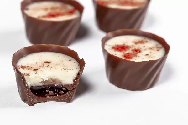 Chocolates with fruit jam and white cream