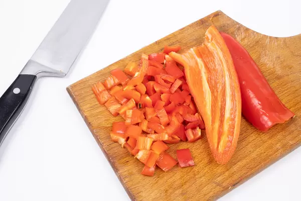 Chopped fresh red Paprika on the wooden board