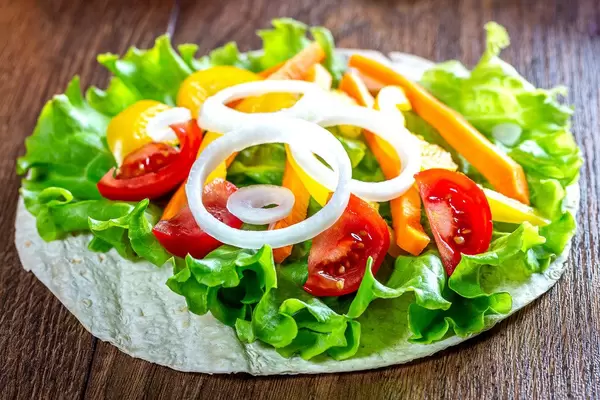 Chopped vegetables and lettuce on pita (Flip 2019)