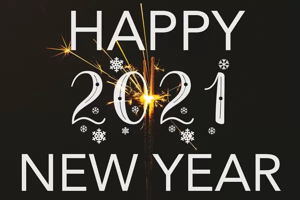 Christmas and New Year party background with sparkler on black