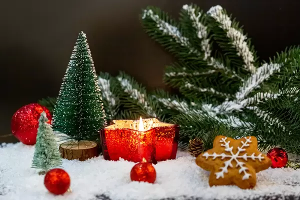 Christmas background with burning candle in a candlestick star