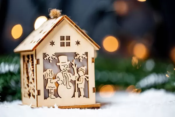 Christmas composition with a lantern, snow on the background of a garland