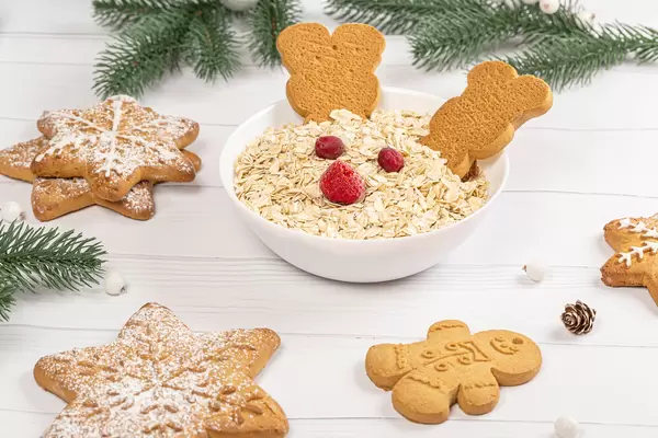 Christmas concept, oatmeal with gingerbread and christmas tree branches
