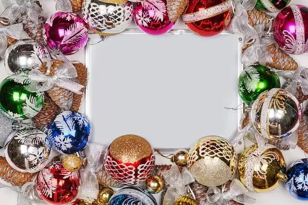 Christmas garland and decoration making a frame around the whiteboard with copy space