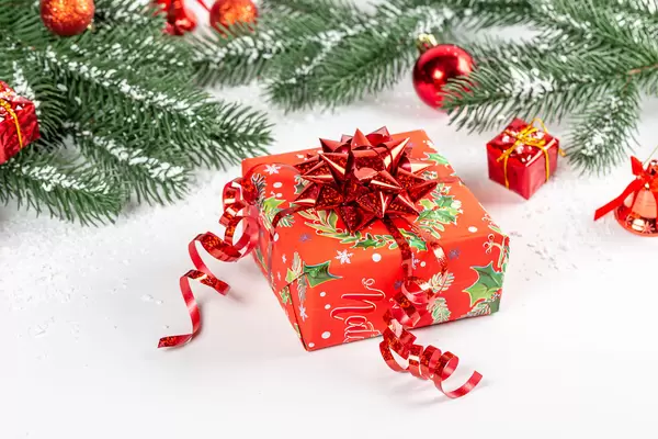 Christmas gift with red bow on new year background
