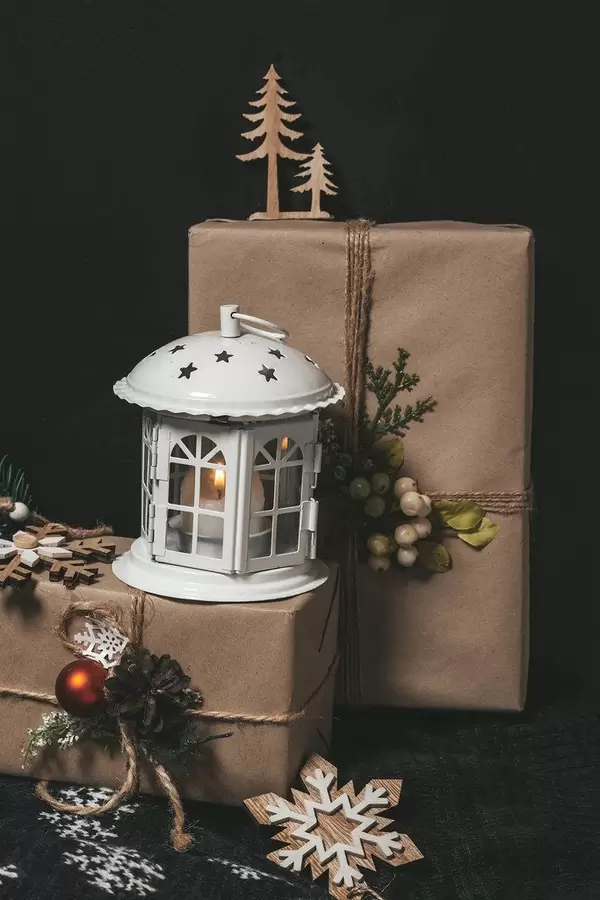 Christmas night background with gifts and lantern