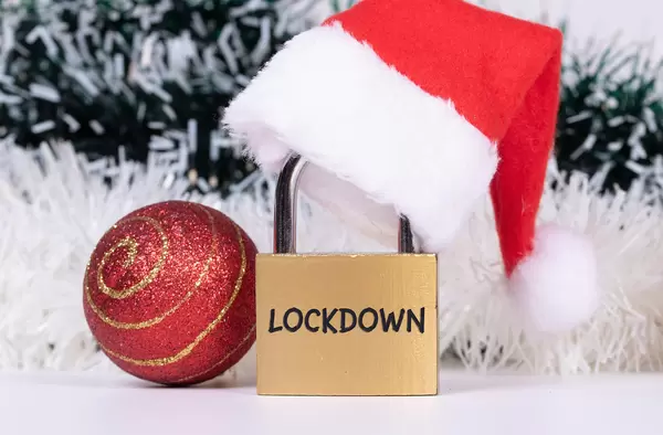 Christmas ornaments and padlock with Christmas hat and Lockdown text