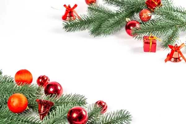 Christmas tree branches with red decor and balls