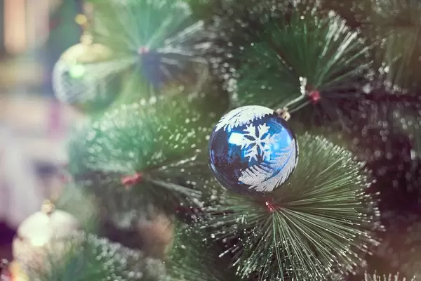 Christmas tree decorated with toys and balls