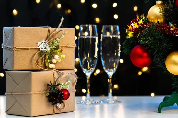 Christmas tree, gifts and glasses of champagne