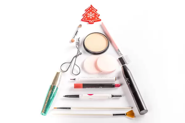 Christmas tree made from cosmetics, brushes, mascara and lipstick