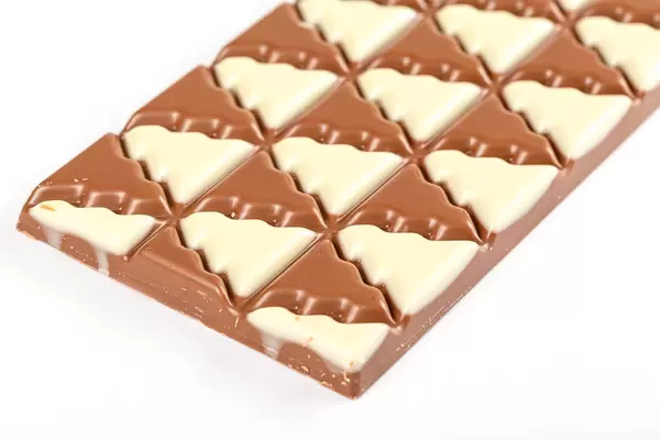 Christmas trees made of white and milk chocolate, close-up
