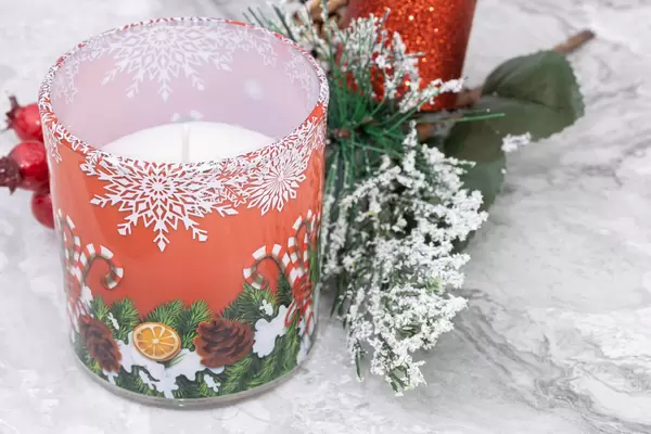 Christmass Candle and winter decoration with frozen branches