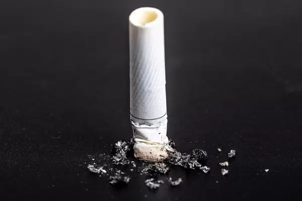 Cigarette butt on black background