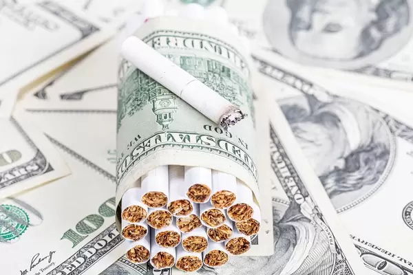 Cigarettes and dollars. Bad habits cost concept