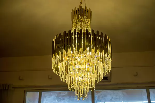 Circular Crystal Chandelier with Bright Light Bulbs in a Coffee Shop in Ho Chi Minh City, Vietnam