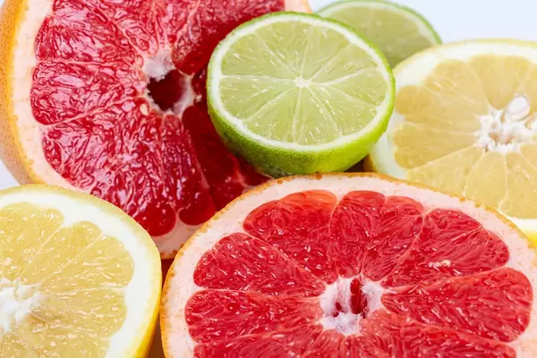 Citrus food background with fresh fruit halves