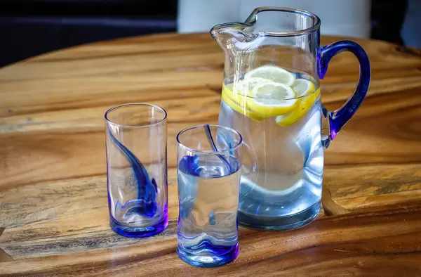 Citrus Water in a Pitcher with Glasses.