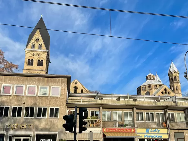 City view in Cologne, Germany with the bell towers of the The Basilica of the Holy Apostles at Neumarkt