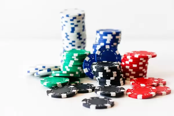 Classical Poker chips in different colours and white background