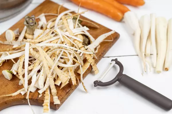 Cleaned and sliced Celery on the wooden board
