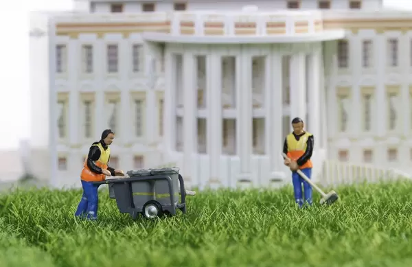 Cleaning workers in front of building
