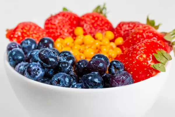 Close-up, a bowl of oatmeal and fresh berries