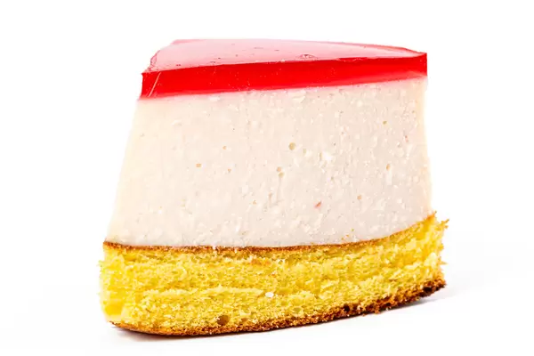 Close-up, a portion of cheesecake on a white background