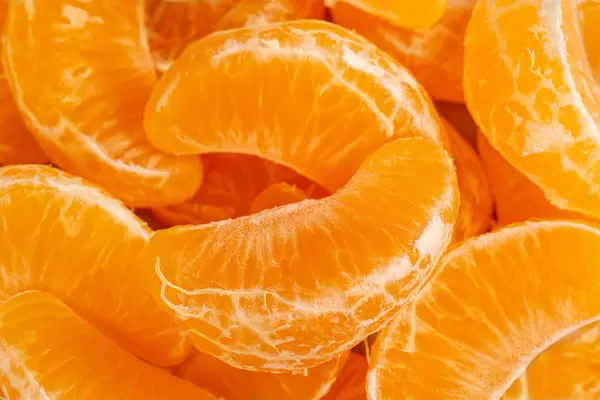 Close-up, background of tangerine slices without peel