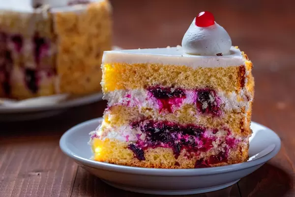 Close up Bokeh on a piece of cream cake with berries
