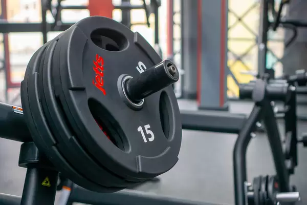 Close Up Bokeh Photo of Fitness Weight Plates on an Exercise Machine in a modern Fitness Center