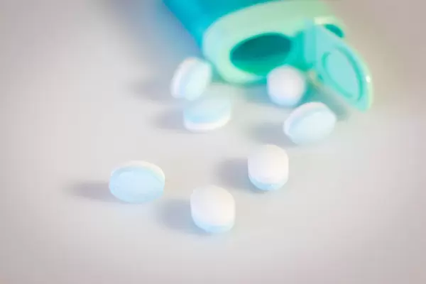 Close Up Bokeh Photo of Mint Dragees on white Background