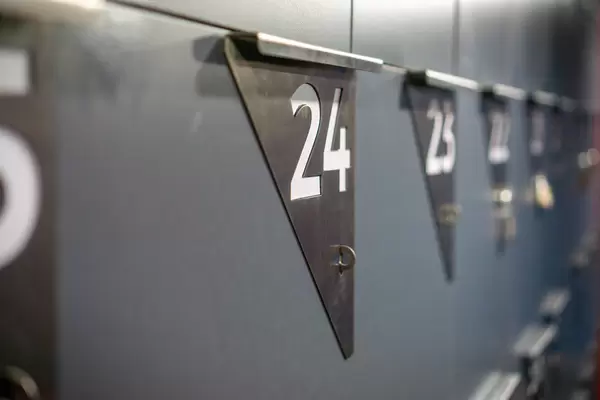 Close Up Bokeh Photo of Numbered Lockers with Padlocks in a Gym
