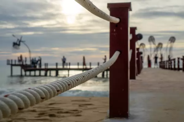 Close Up Bokeh Photo of Rope from a Footbridge leading to Photo Spots on the Sea at Sunset Sanato Beach Club in Phu Quoc, Vietnam