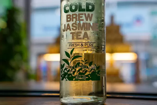 Close Up Bokeh Photo of Trend Drink Cold Brew Jasmine Tea in a Glass Bottle