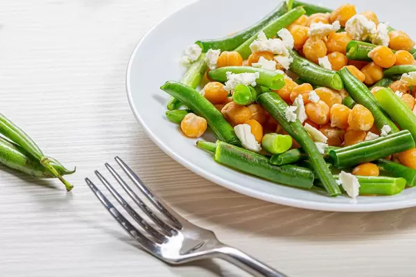 Close up chickpeas with asparagus beans and feta cheese