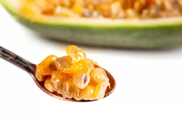 Close-up, curuba pulp with seeds in a small spoon