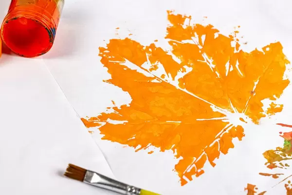 Close-up drawing of an orange maple leaf