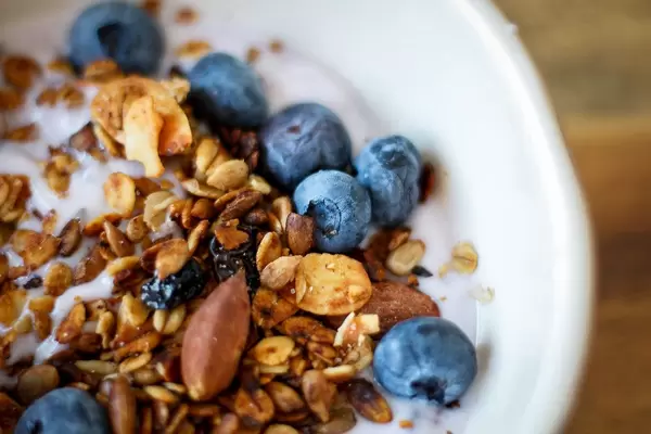 Close Up Food Photo of Healthy Bowl with Yoghurt, Blueberries, Almonds and Granola