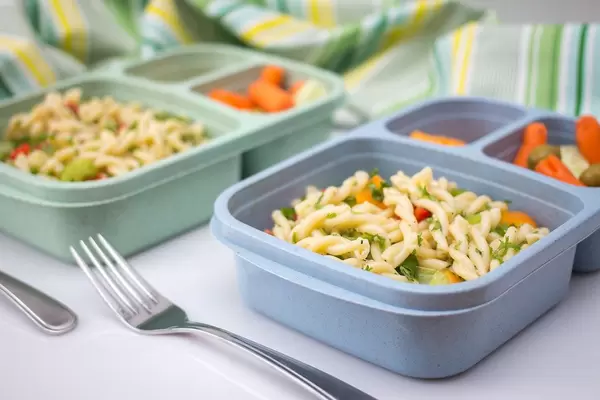 Close Up Food Photo of Lunch Box with Pasta and Vegetables with Fork