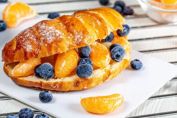 Close-up fruit sandwich with tangerines and blueberries