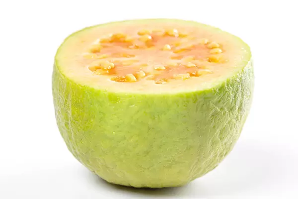 Close-up, half of fresh guava fruit on white