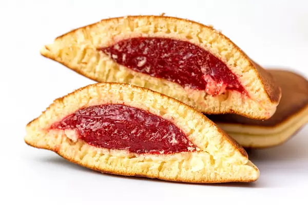 Close-up, halved pancakes with raspberry jam