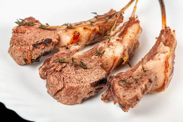 Close-up, hot juicy grilled ribs with rosemary