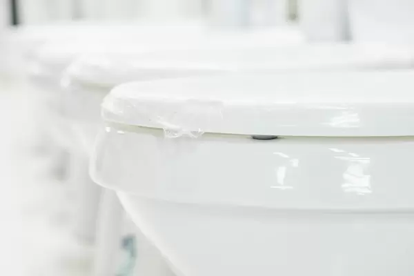 Close-up image of toilet bowls in the shop