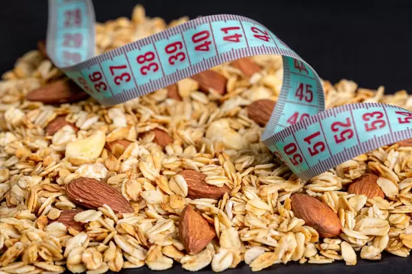 Close-up, measuring tape on oatmeal