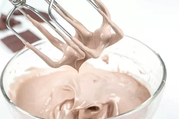 Close-up, mixer whisk with chocolate ice cream