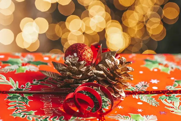 Close-up, new year gift with bokeh garlands behind