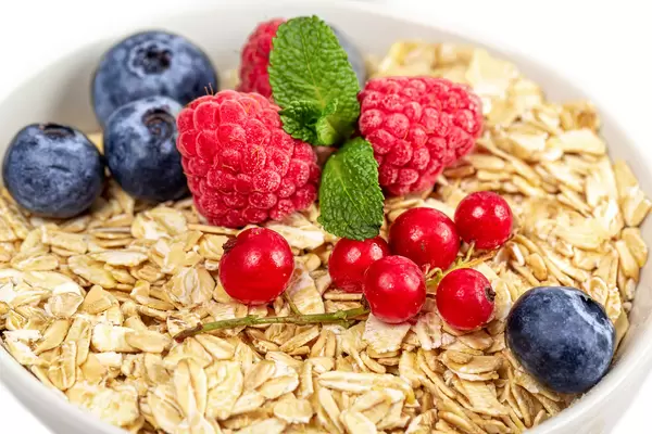 Close-up, oatmeal with berries and fresh mint