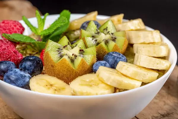 Close-up, oatmeal with berries, banana and kiwi